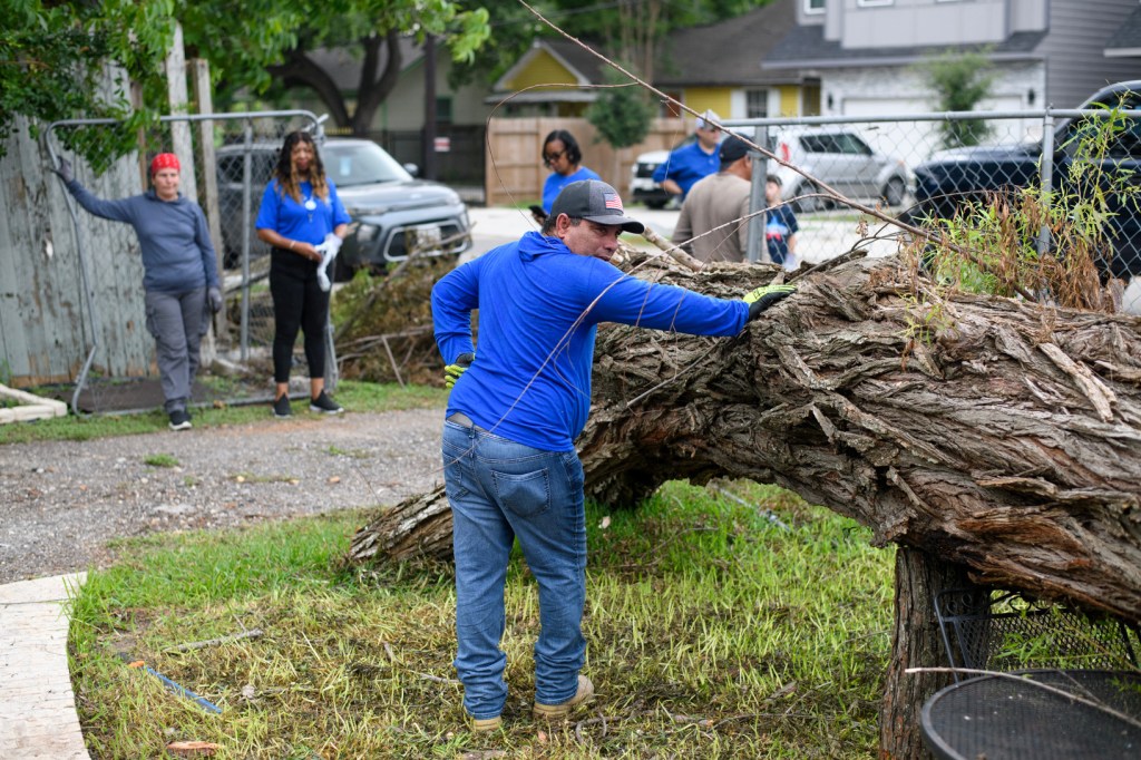 Volunteers unite to clean up toppled trees after Houston storm